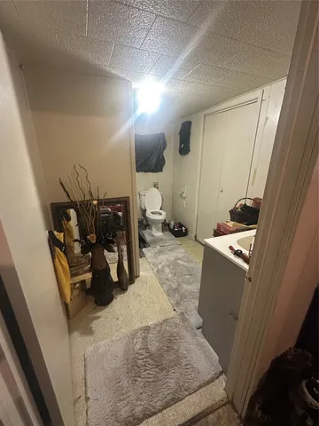 a bedroom with a bed and a mirror