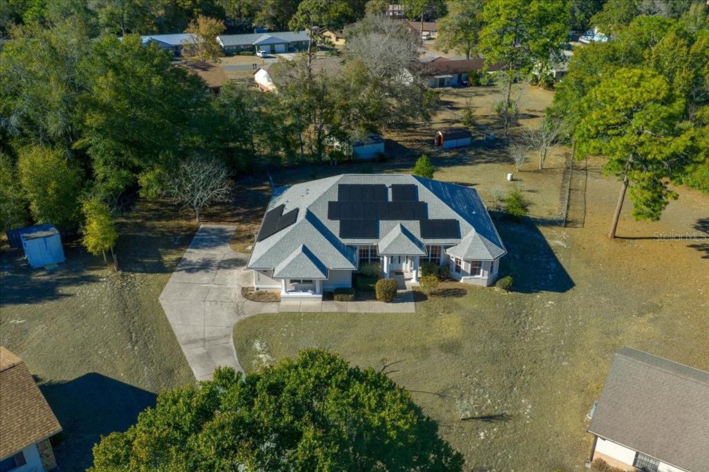 10308 Southwest 83rd Terrace Ocala, FL 34481 - Photo 11 of 75 an aerial view of a house with swimming pool