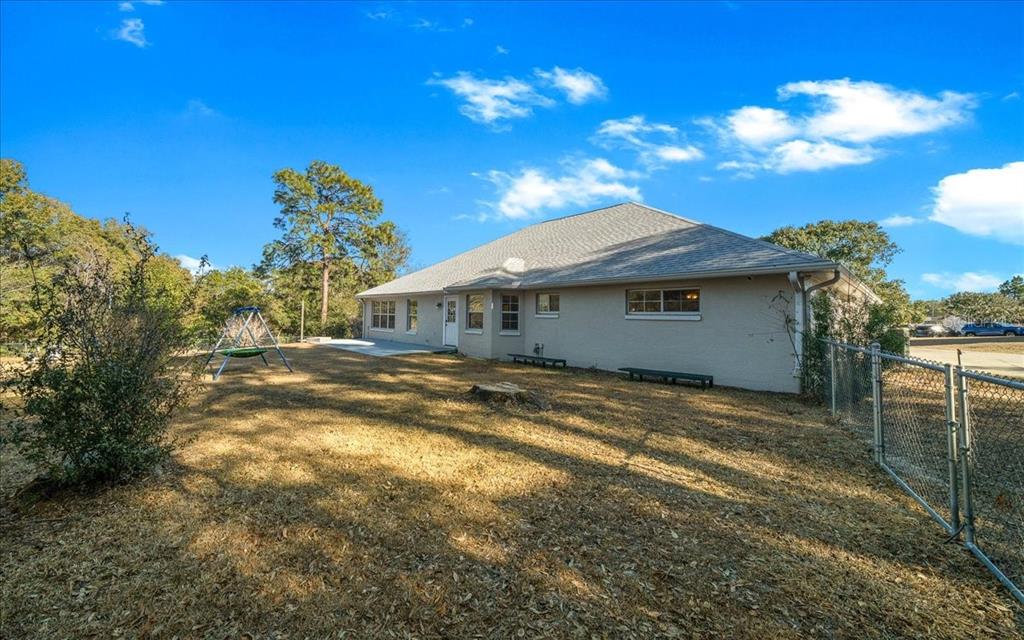 10308 Southwest 83rd Terrace Ocala, FL 34481 - Photo 26 of 75 a view of a house with a yard