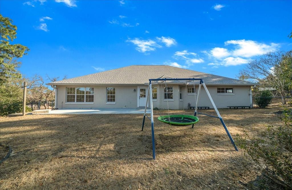 10308 Southwest 83rd Terrace Ocala, FL 34481 - Photo 27 of 75 a view of a house with a yard