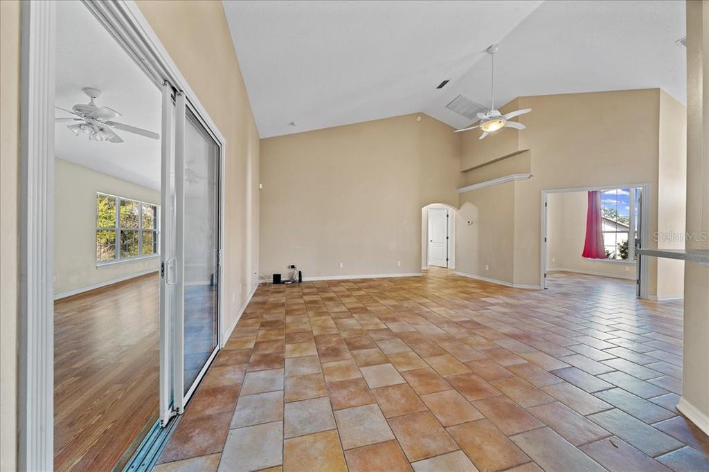 10308 Southwest 83rd Terrace Ocala, FL 34481 - Photo 42 of 75 a view of a hallway view with wooden floor and staircase