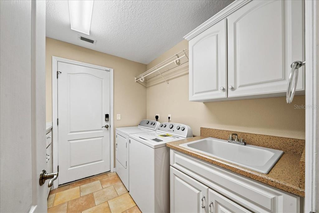 10308 Southwest 83rd Terrace Ocala, FL 34481 - Photo 55 of 75 a room with a sink and cabinets