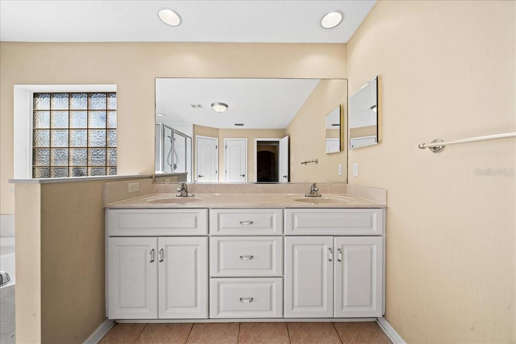 10308 Southwest 83rd Terrace Ocala, FL 34481 - Photo 57 of 75 a bathroom with a sink and a mirror