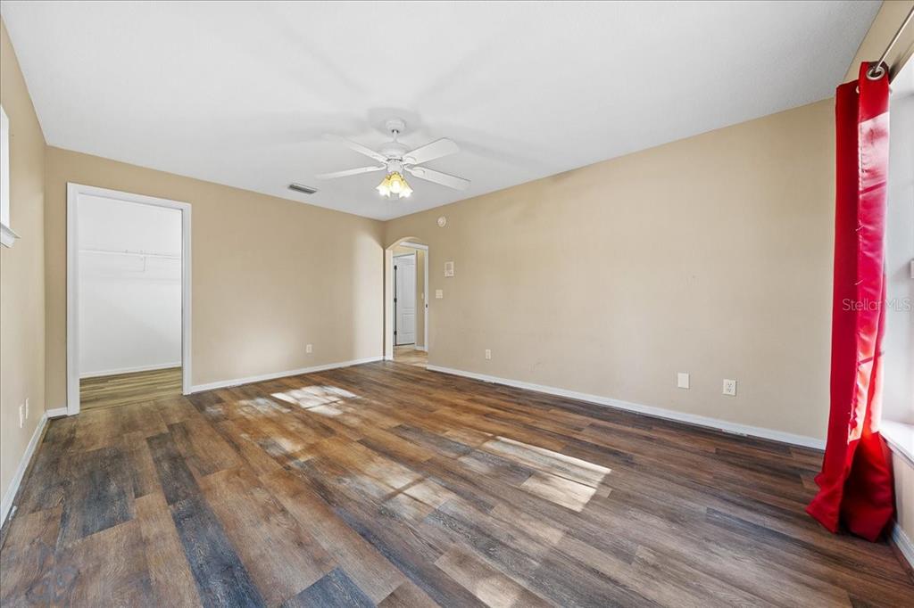 10308 Southwest 83rd Terrace Ocala, FL 34481 - Photo 62 of 75 a view of an empty room and wooden floor