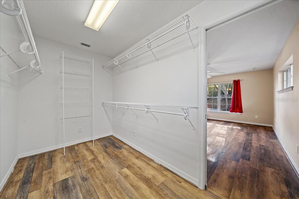 10308 Southwest 83rd Terrace Ocala, FL 34481 - Photo 64 of 75 a view of a room with wooden floor and staircase
