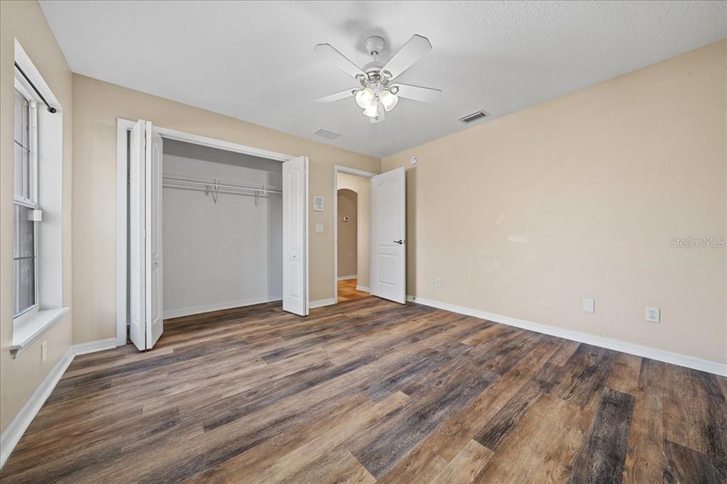10308 Southwest 83rd Terrace Ocala, FL 34481 - Photo 70 of 75 a view of an empty room with wooden floor