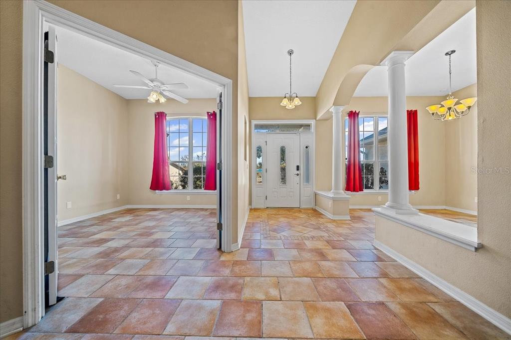 10308 Southwest 83rd Terrace Ocala, FL 34481 - Photo 73 of 75 a view of an entryway with a chandelier