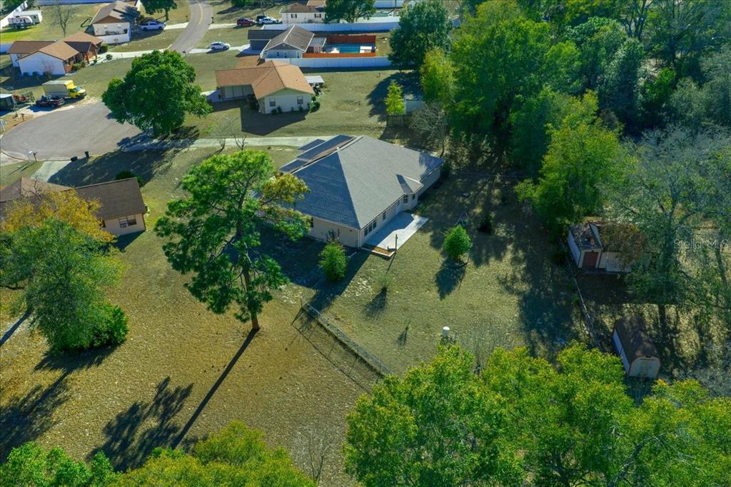 10308 Southwest 83rd Terrace Ocala, FL 34481 - Photo 10 of 75 an aerial view of a house with a yard and lake view