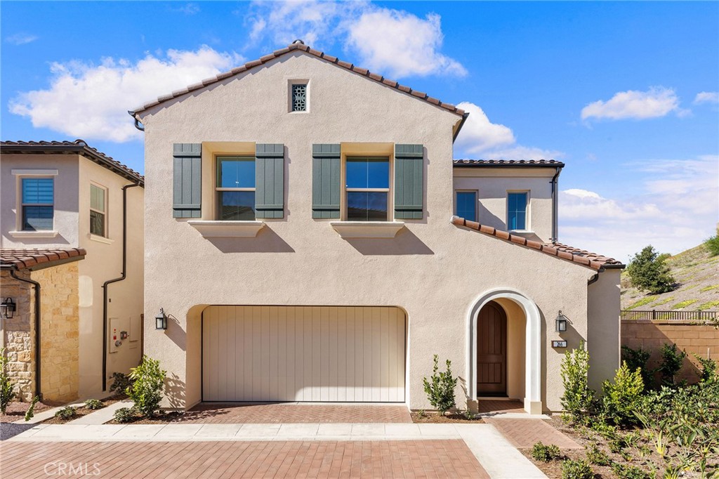 a front view of a house with yard