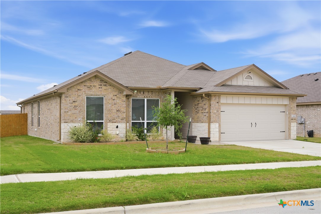 3201 Hedwig Street Killeen, TX 76549 - Photo 3 of 38 a front view of a house with a yard