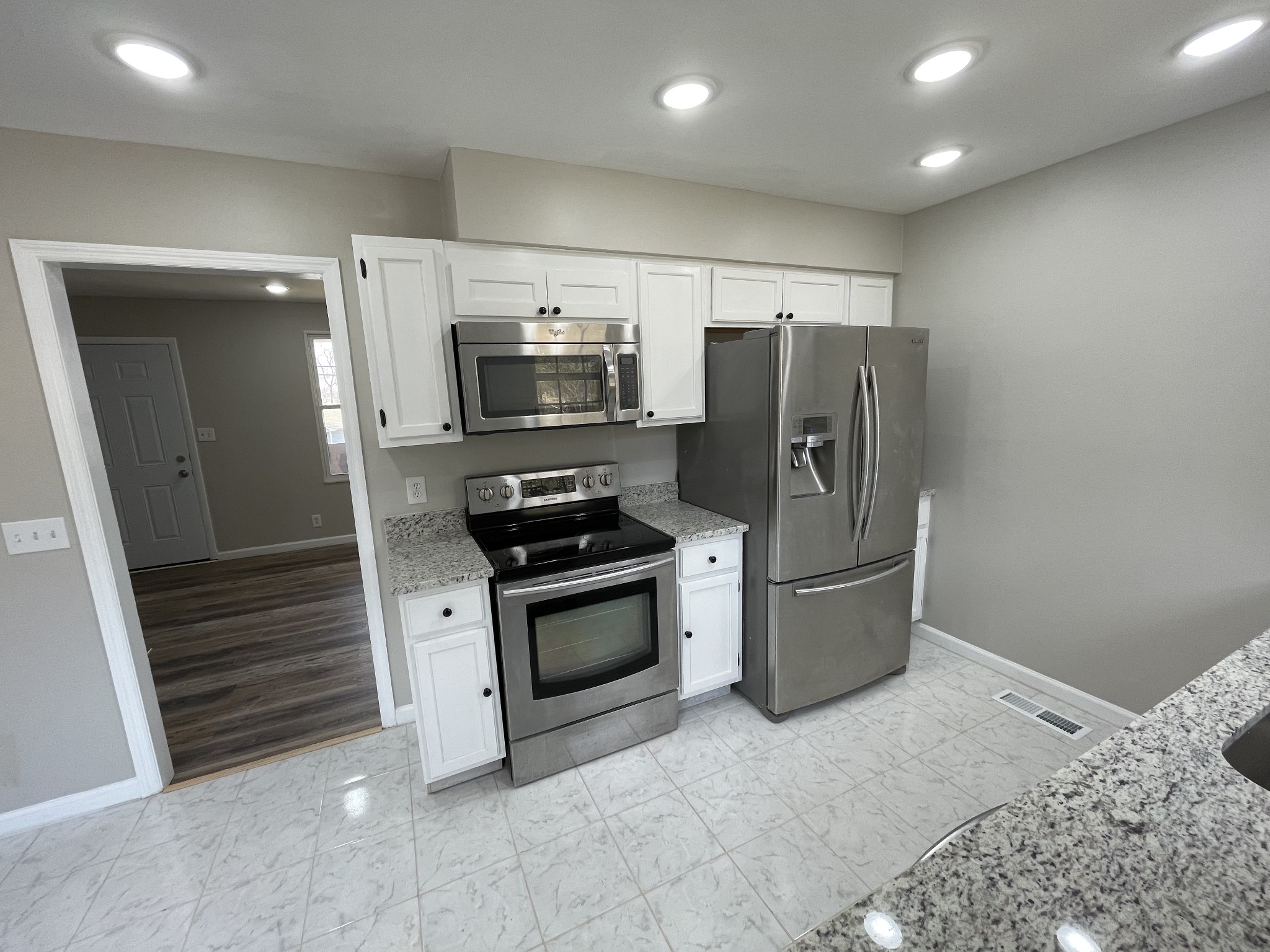 3289 Anderson Road Antioch, TN 37013 - Photo 12 of 40 a kitchen with stainless steel appliances a refrigerator a stove a microwave and cabinets