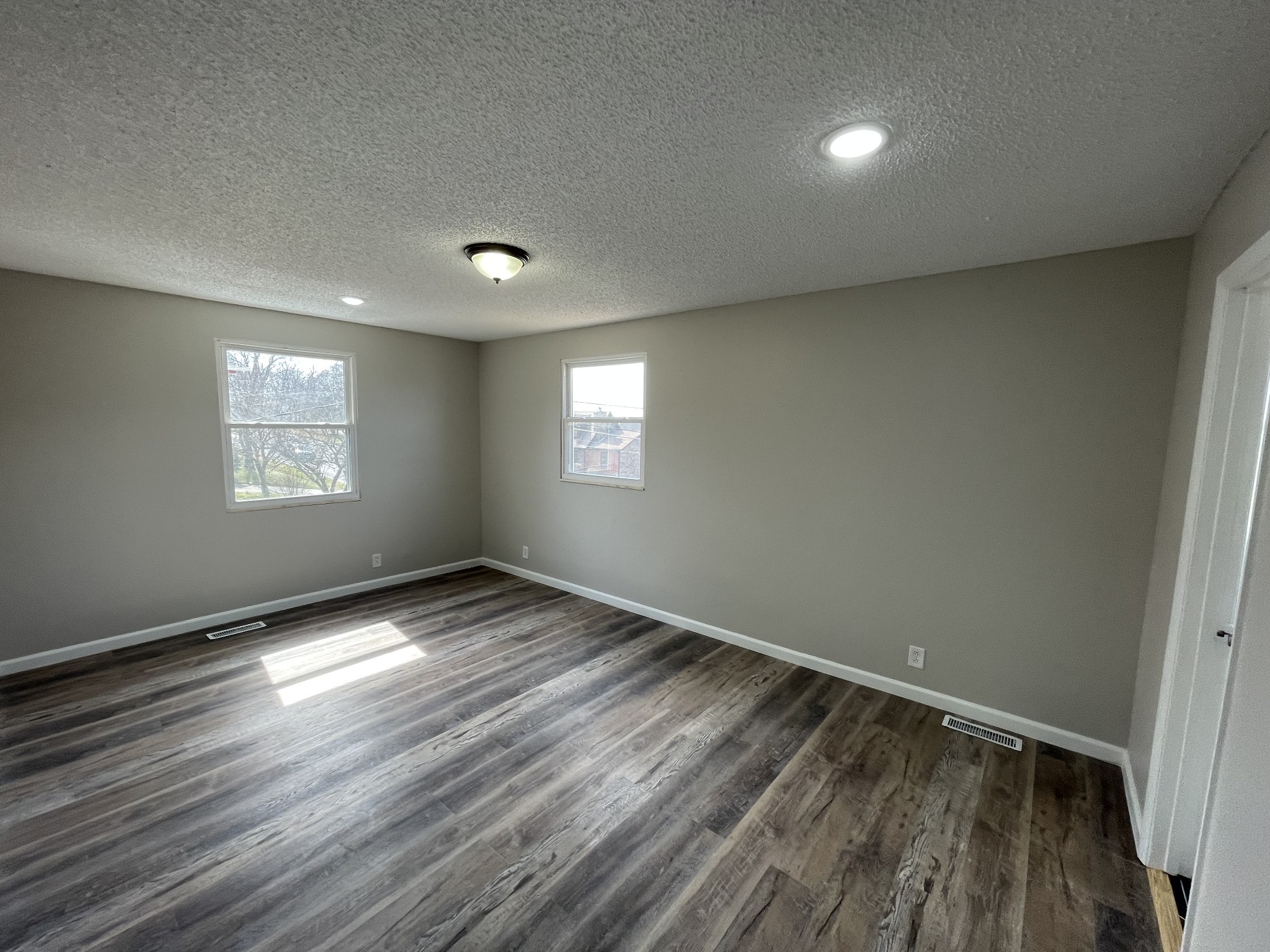 3289 Anderson Road Antioch, TN 37013 - Photo 25 of 40 an empty room with wooden floor and windows