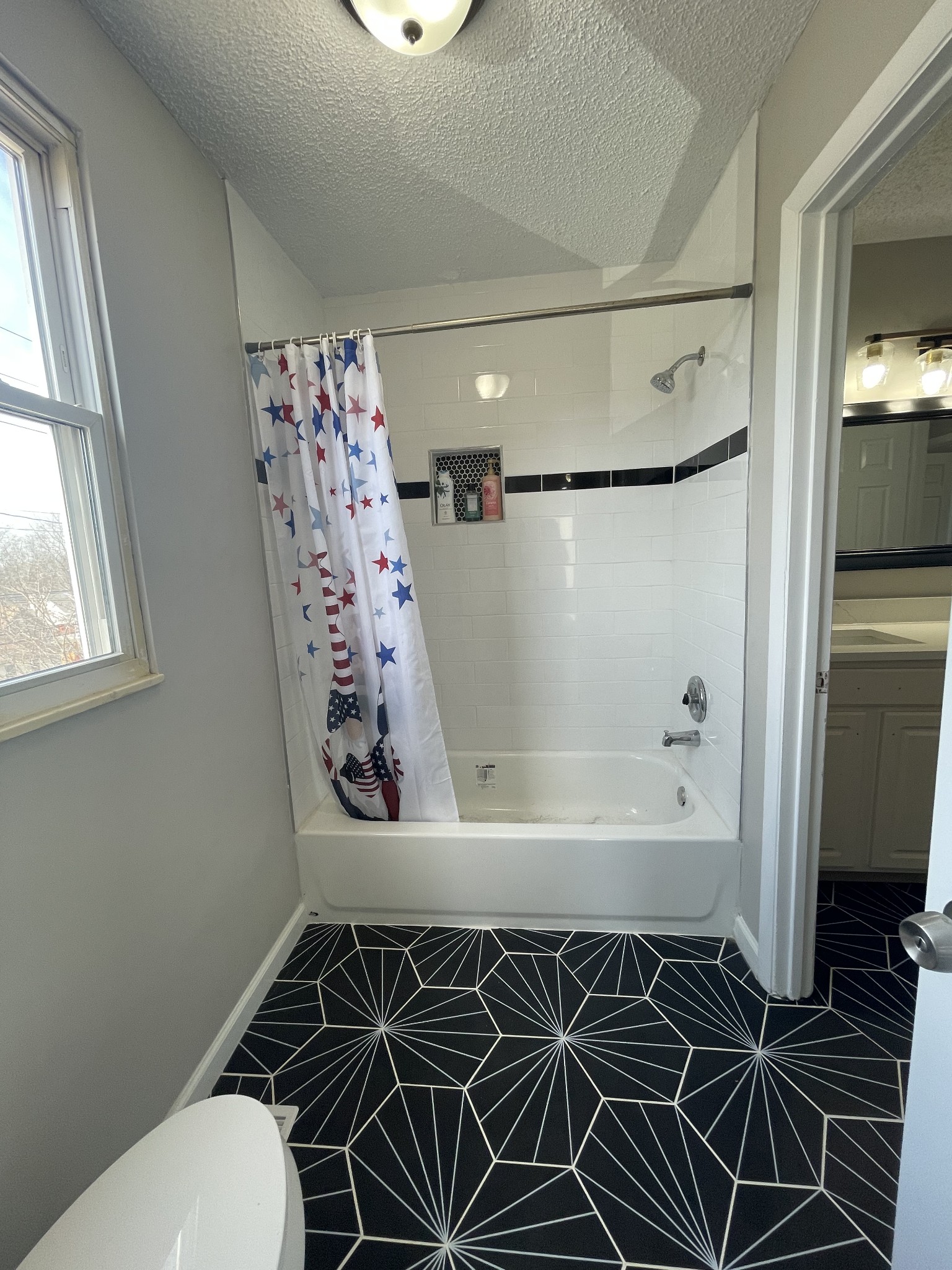 3289 Anderson Road Antioch, TN 37013 - Photo 32 of 40 a bathroom with a bathtub and shower