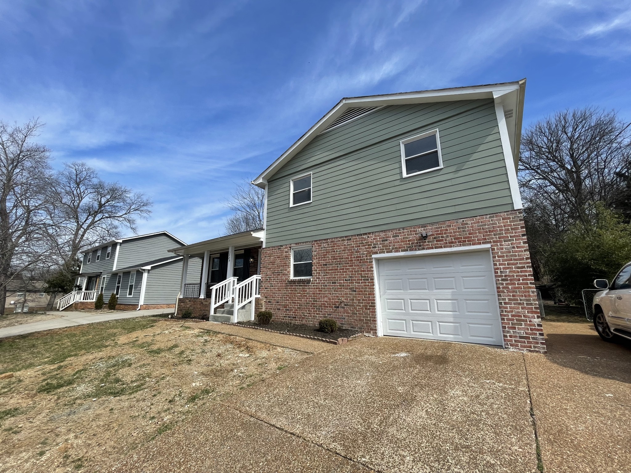 3289 Anderson Road Antioch, TN 37013 - Photo 35 of 40 a front view of a house with a yard and garage