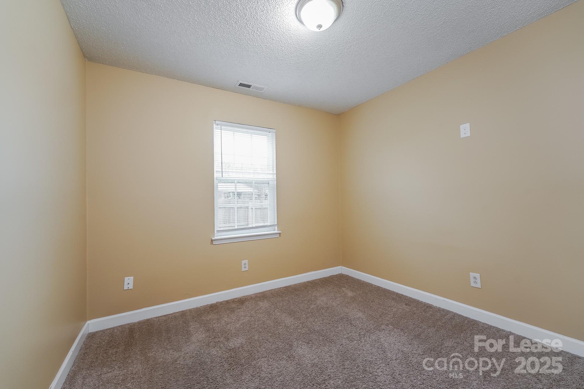 4110 Runaway Circle Monroe, NC 28110 - Photo 12 of 16 an empty room with a window