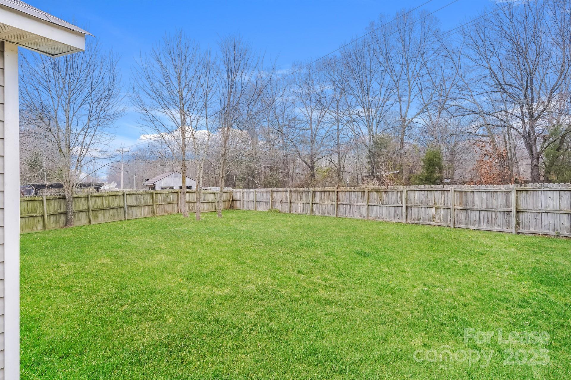 4110 Runaway Circle Monroe, NC 28110 - Photo 14 of 16 a view of yard with grass and trees
