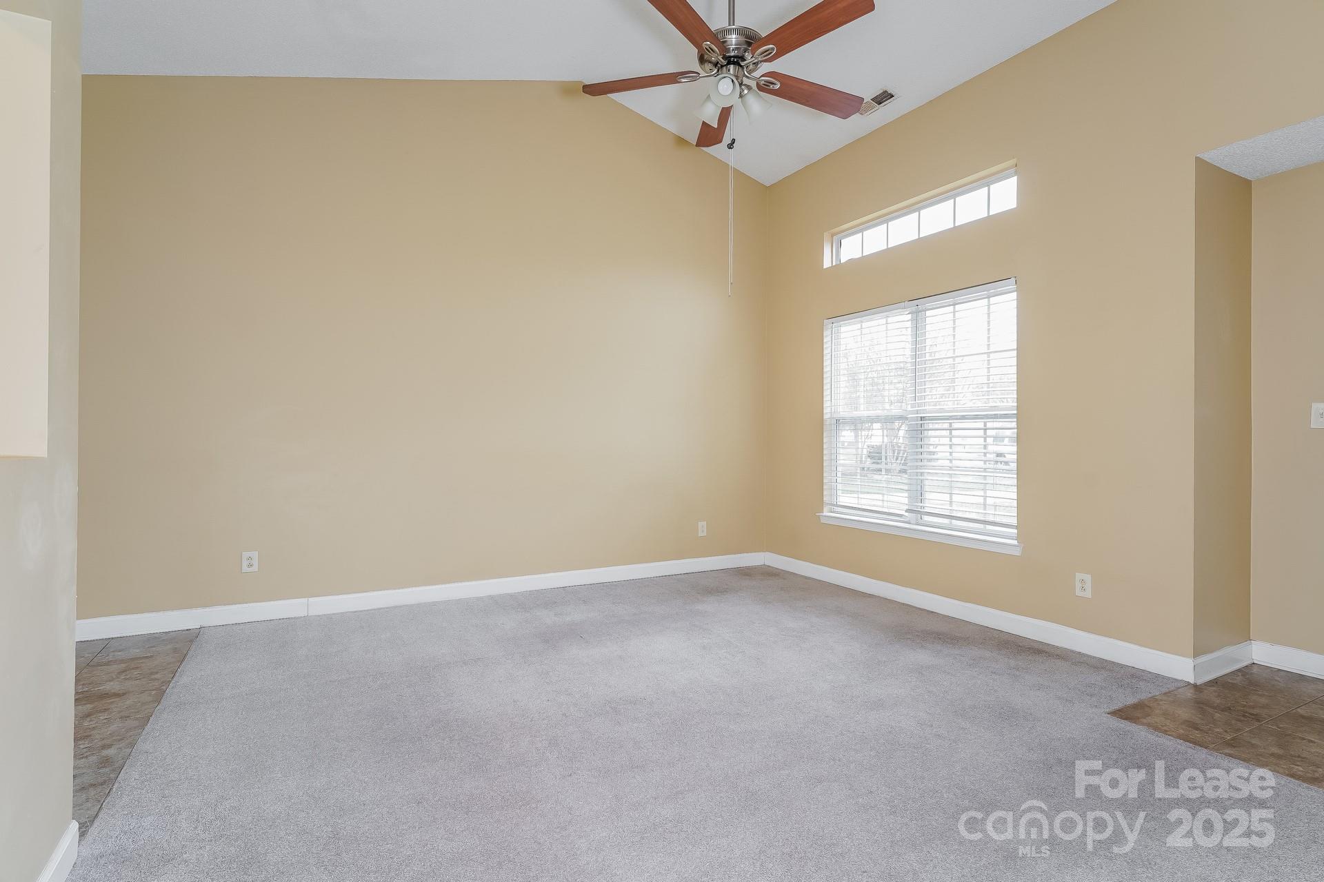 4110 Runaway Circle Monroe, NC 28110 - Photo 3 of 16 an empty room with a window and a fan