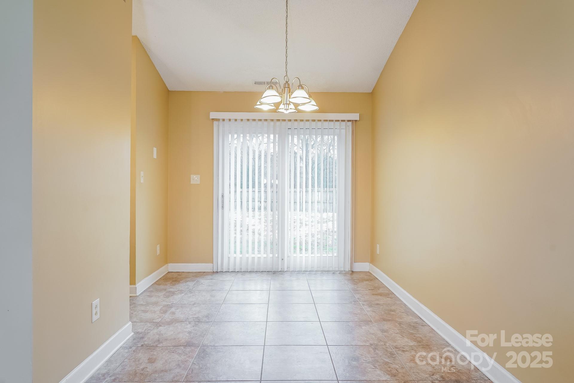 4110 Runaway Circle Monroe, NC 28110 - Photo 5 of 16 a view of an empty room with a window