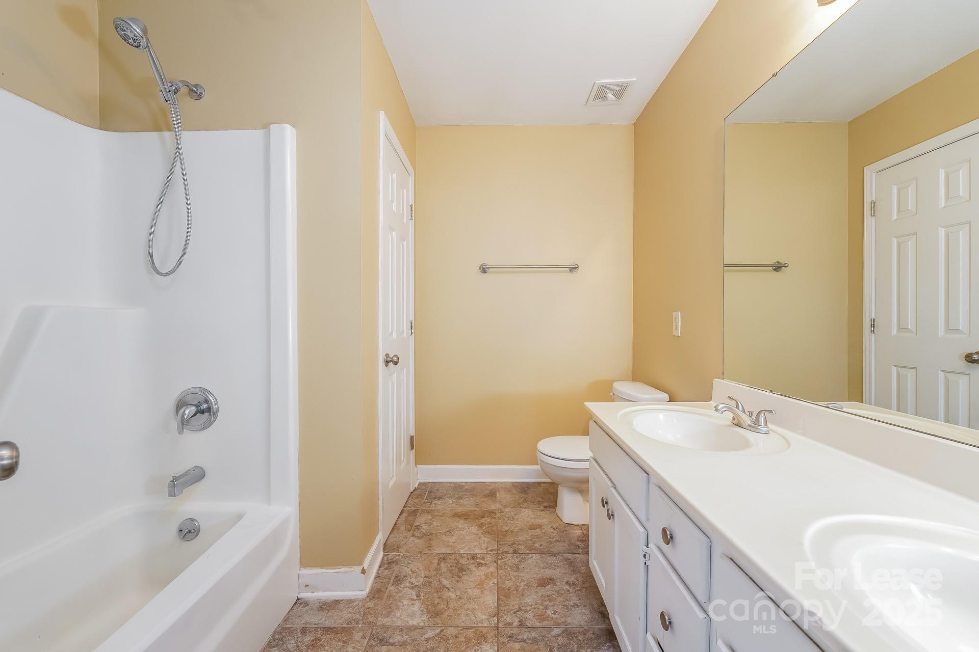 4110 Runaway Circle Monroe, NC 28110 - Photo 10 of 16 a bathroom with a sink a toilet and shower