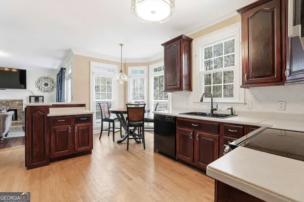 a kitchen with lots of counter top space and dining table