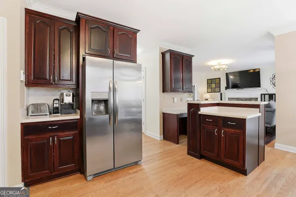 a kitchen with a refrigerator sink and microwave