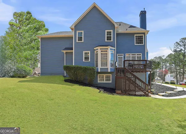 a view of a lake with a house in the background