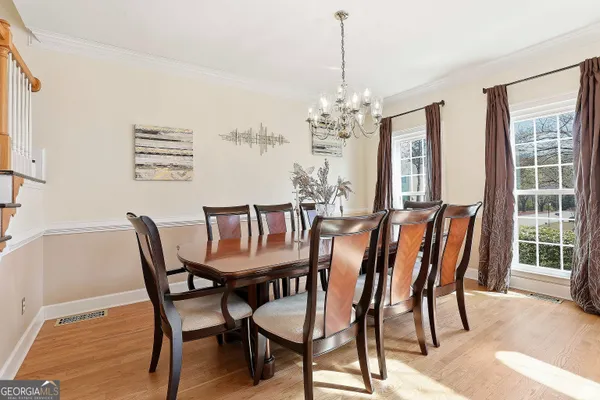 a view of a dining room with furniture window and outside view