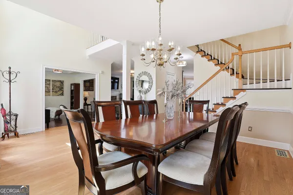 a view of a dining room with furniture and wooden floor