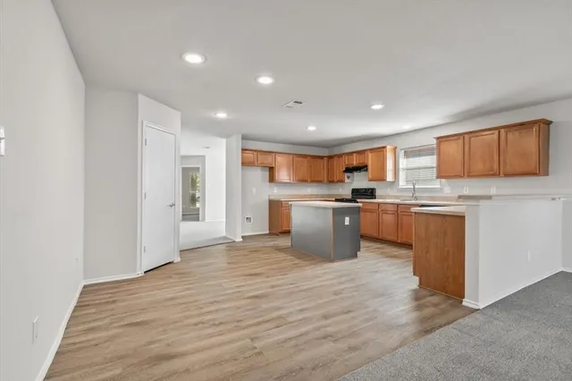 a view of kitchen with wooden floor