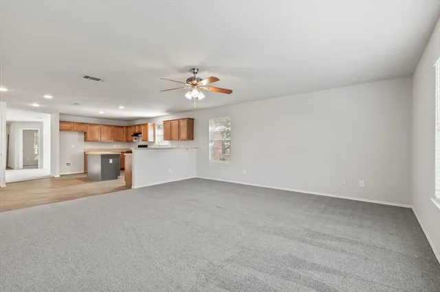 a view of a kitchen with a sink and a stove top oven
