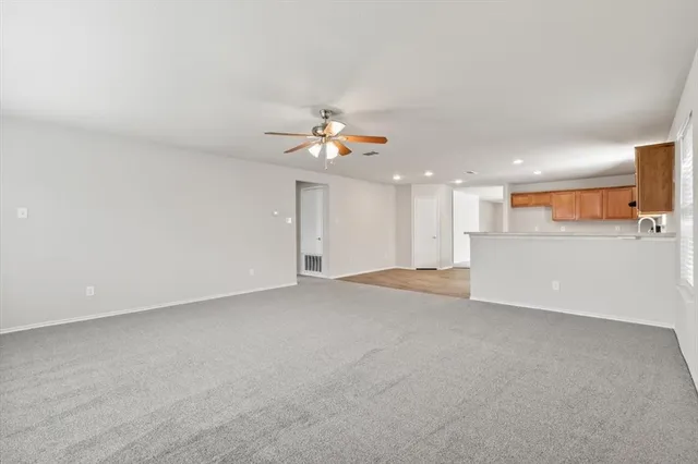 a view of a kitchen with a sink and a chandelier