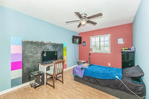 a view of livingroom with hardwood floor and a ceiling fan