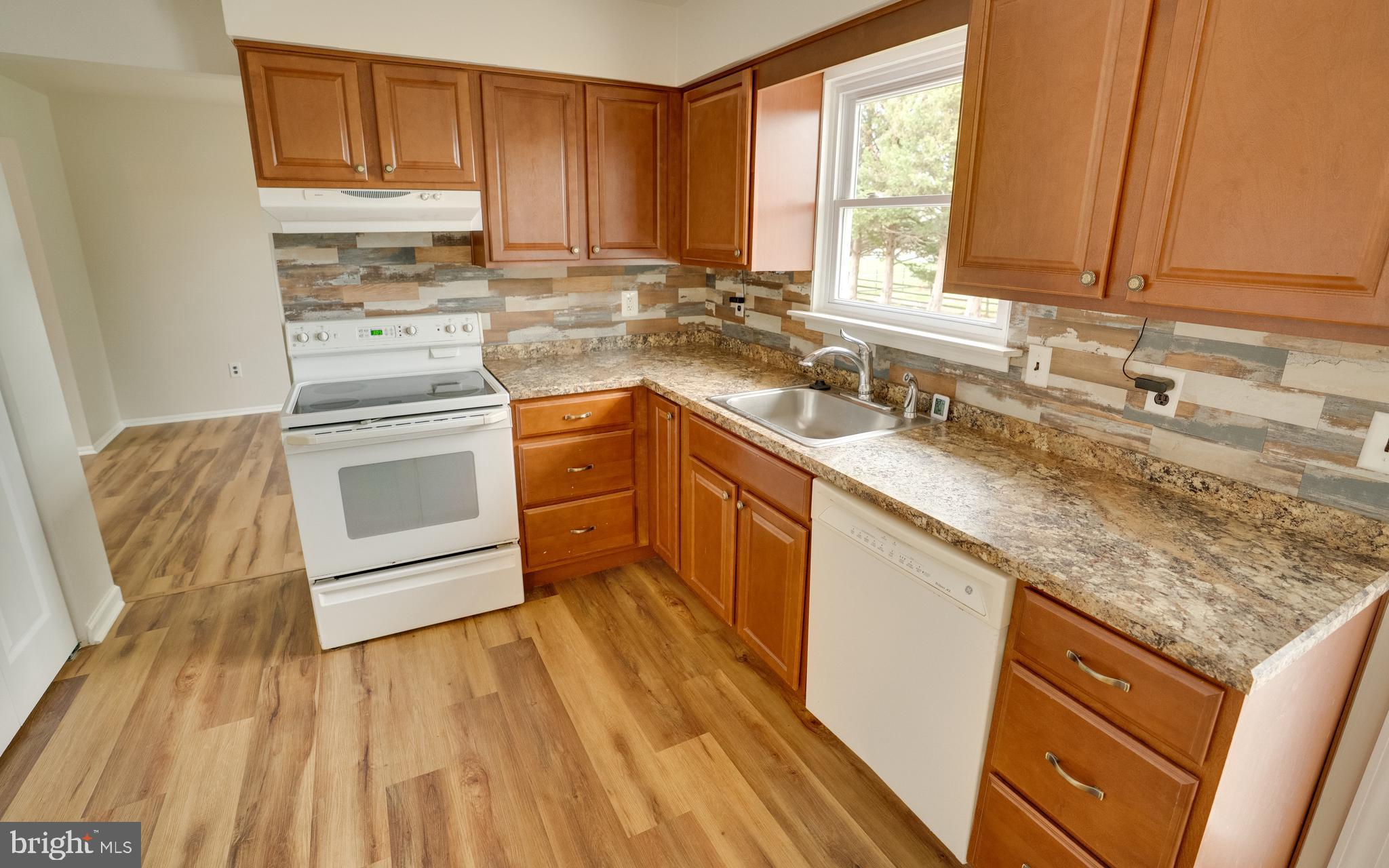 32 Southbridge Road Bear, DE 19701 - Photo 12 of 57 a kitchen with a sink stove and cabinets