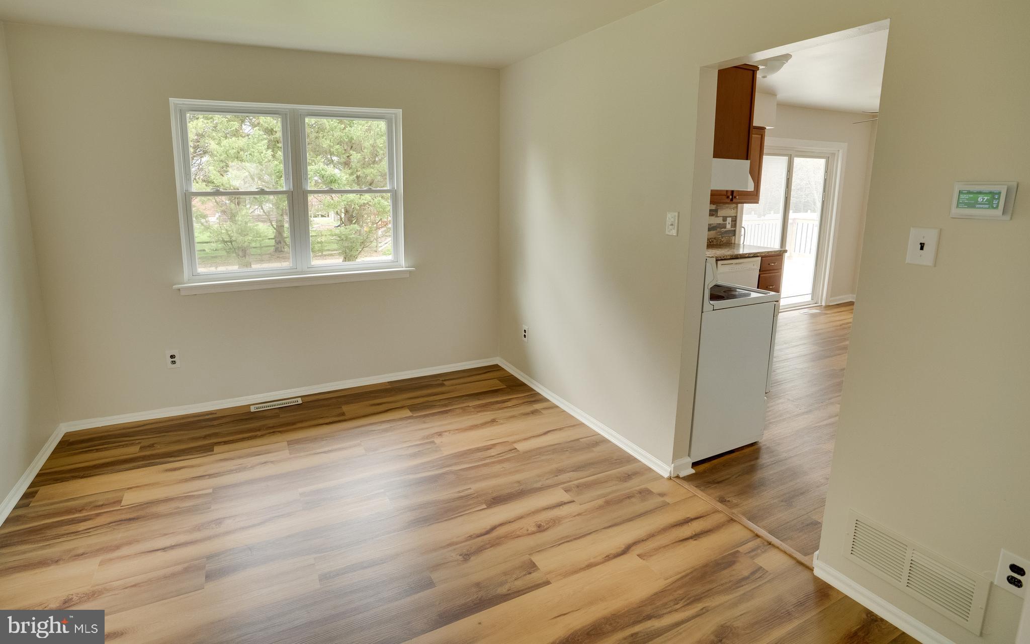 32 Southbridge Road Bear, DE 19701 - Photo 17 of 57 an empty room with wooden floor and windows
