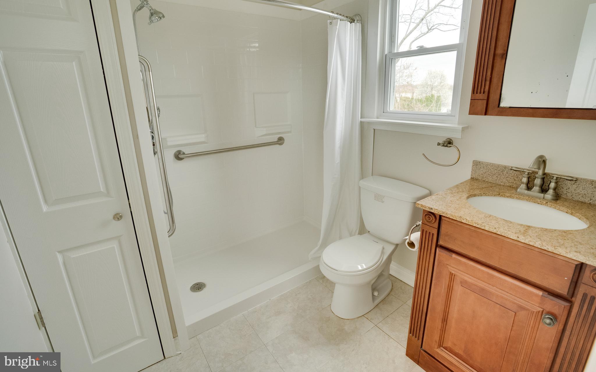 32 Southbridge Road Bear, DE 19701 - Photo 40 of 57 a bathroom with a granite countertop sink toilet and shower