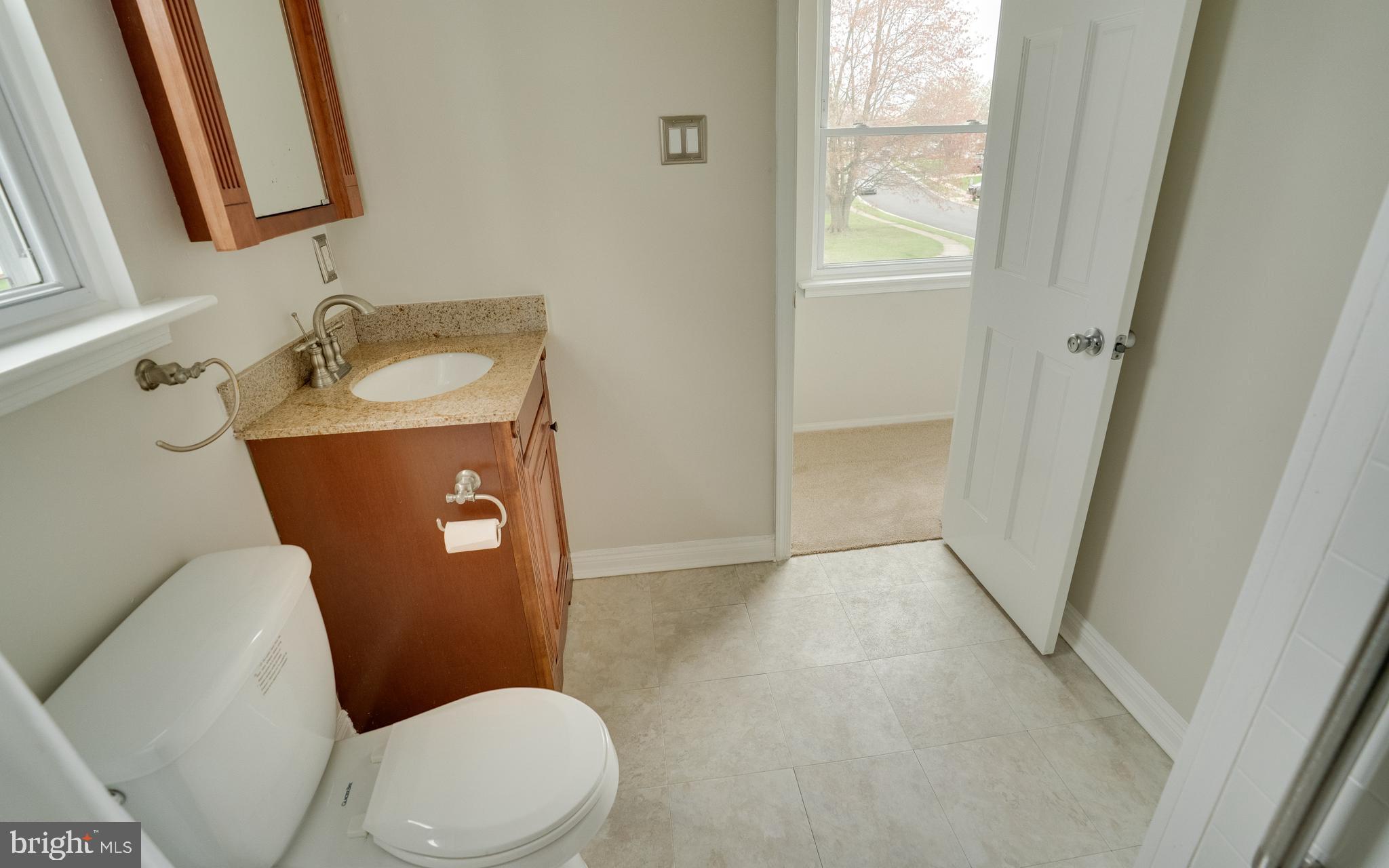 32 Southbridge Road Bear, DE 19701 - Photo 42 of 57 a bathroom with a granite countertop toilet and a sink