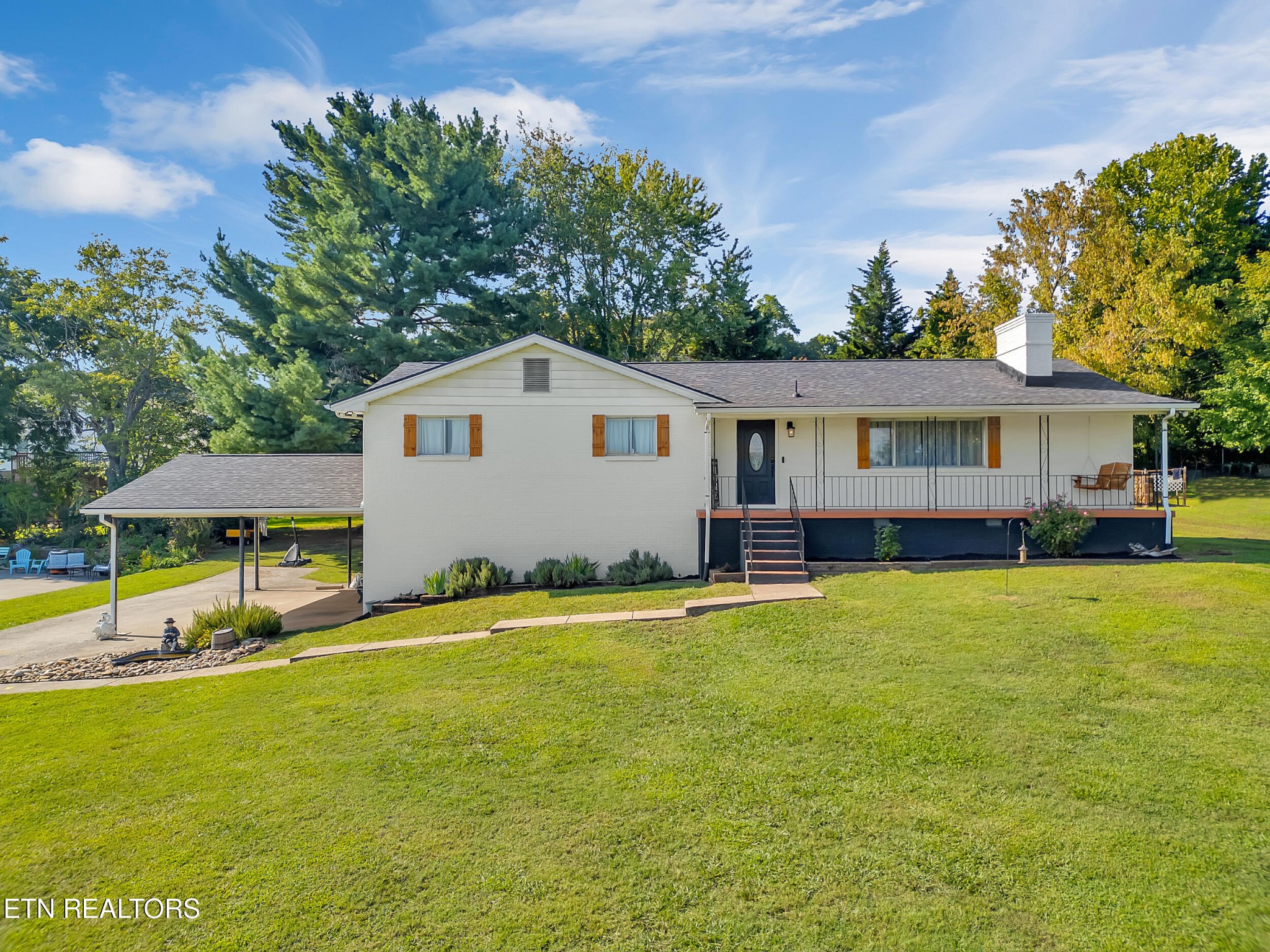 a house with swimming pool in front of it