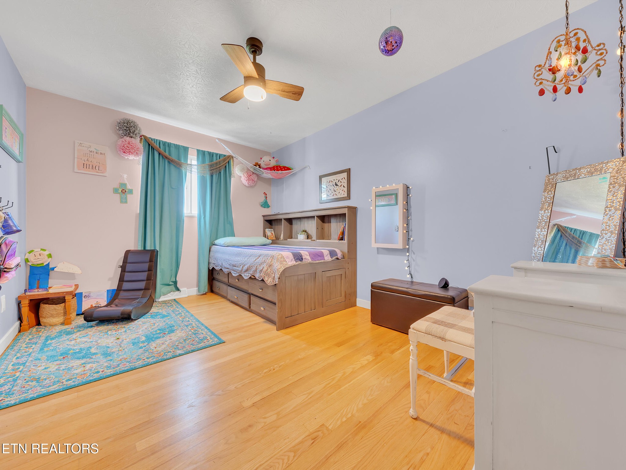 217 Mayview Drive Powell, TN 37849 - Photo 17 of 42 a bedroom with a bed and a chandelier