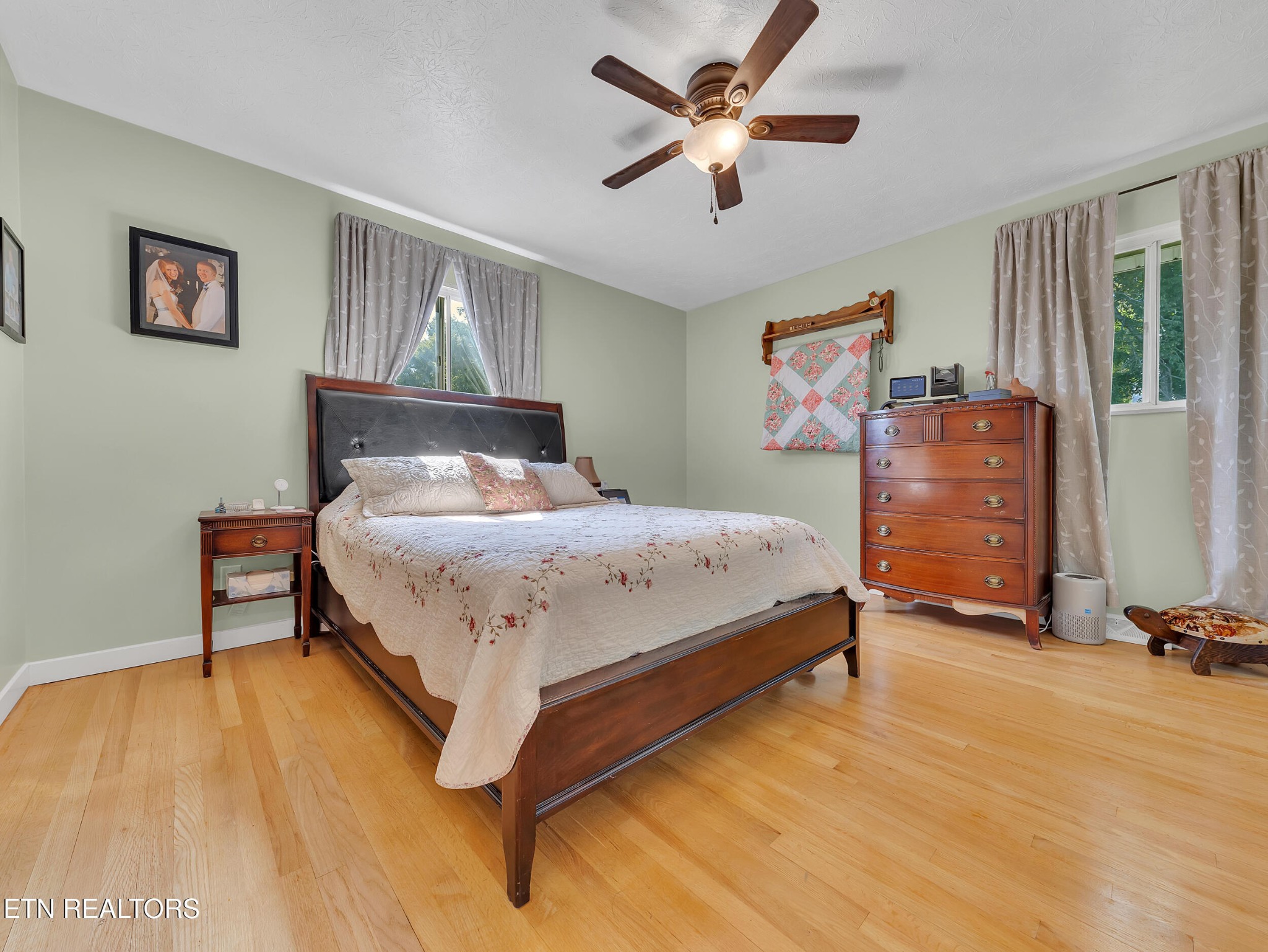 217 Mayview Drive Powell, TN 37849 - Photo 23 of 42 a bedroom with a bed and a chandelier