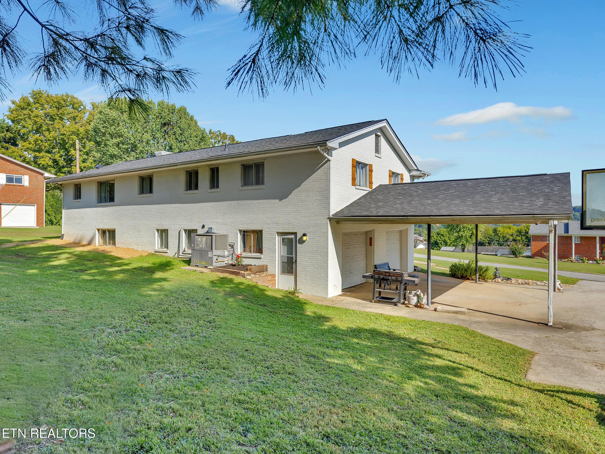 217 Mayview Drive Powell, TN 37849 - Photo 32 of 42 a view of a house with a yard patio and sitting area
