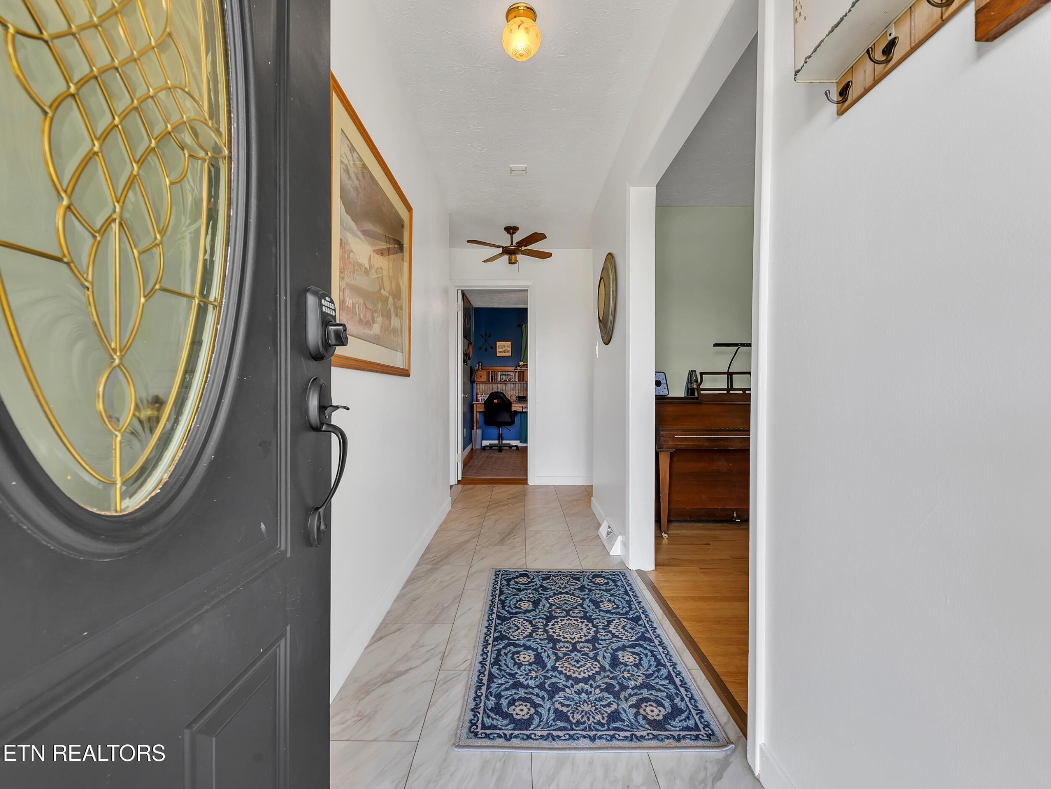 217 Mayview Drive Powell, TN 37849 - Photo 6 of 42 a view of a hallway with wooden floor and windows