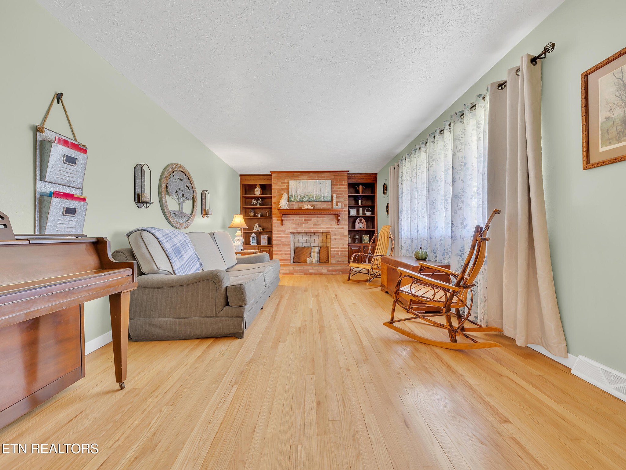 217 Mayview Drive Powell, TN 37849 - Photo 7 of 42 a living room with furniture and a wooden floor