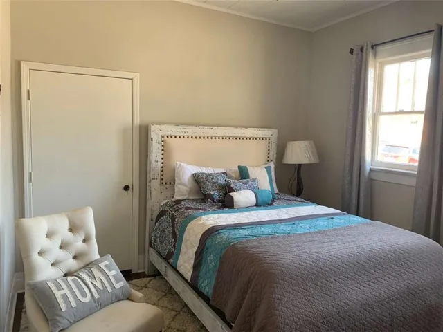 a bed room with a bed and a couch