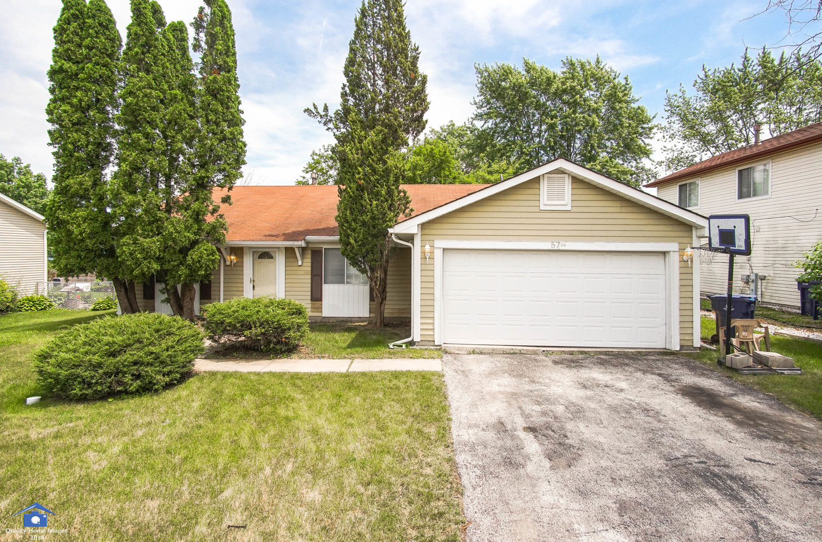 57 Pheasant Road Matteson, IL 60443 - Photo 1 of 1 a front view of a house with a yard and garage
