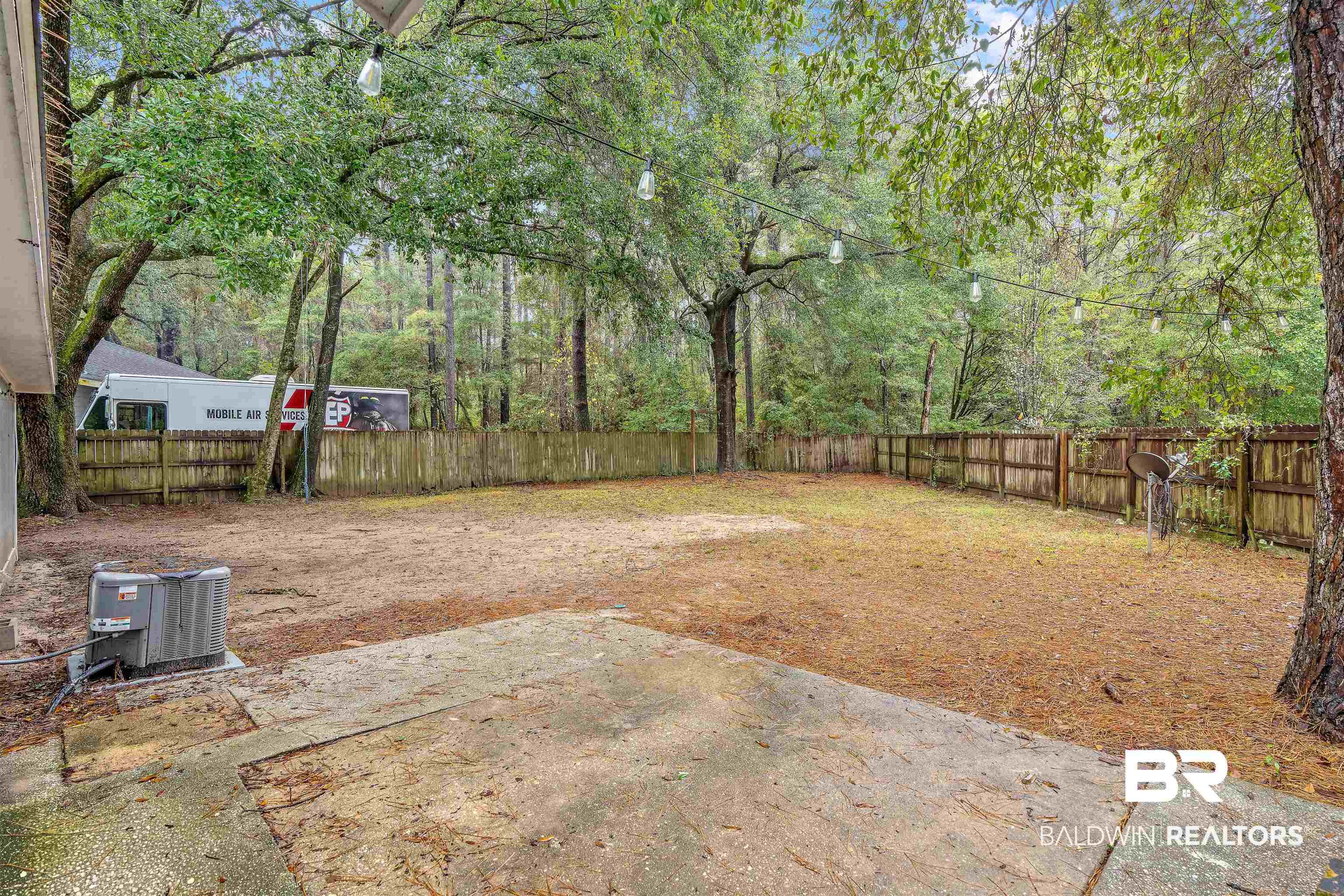 159 Montclair Loop Daphne, AL 36526 - Photo 17 of 18 Fenced backyard featuring a patio