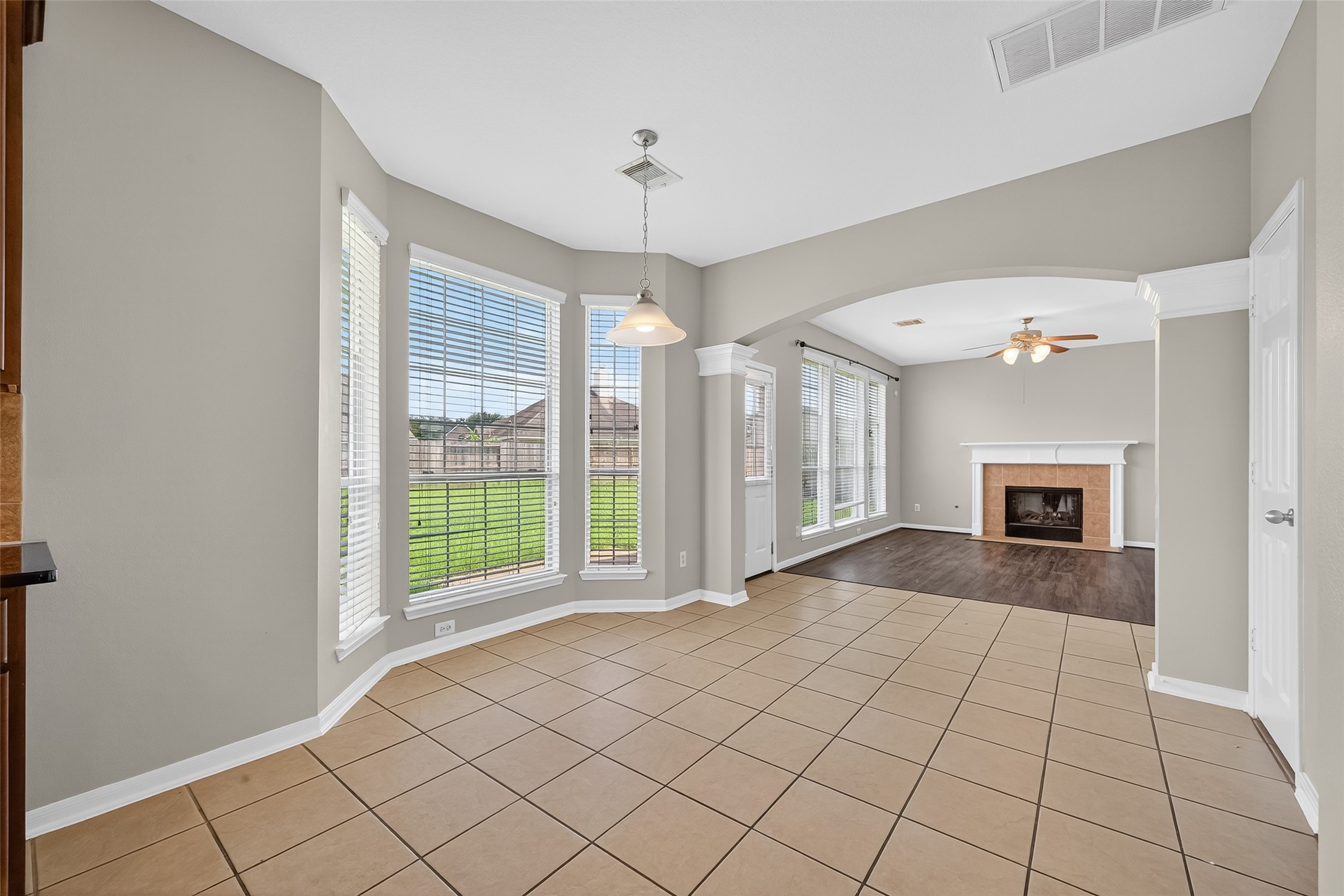12902 Crystal Reef Court Pearland, TX 77584 - Photo 11 of 35 a view of an empty room with window and chandelier fan