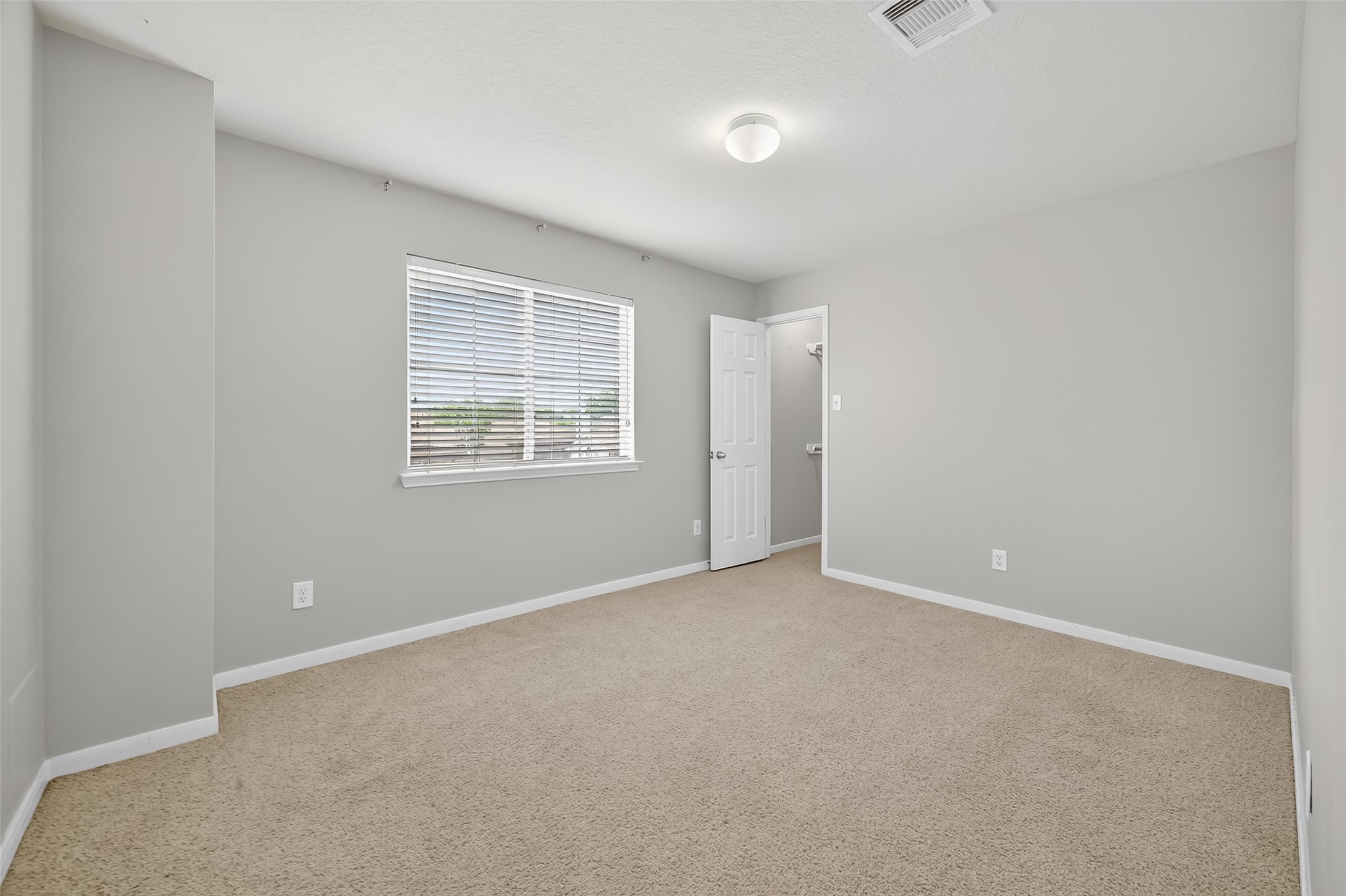 12902 Crystal Reef Court Pearland, TX 77584 - Photo 20 of 35 a view of an empty room with a window
