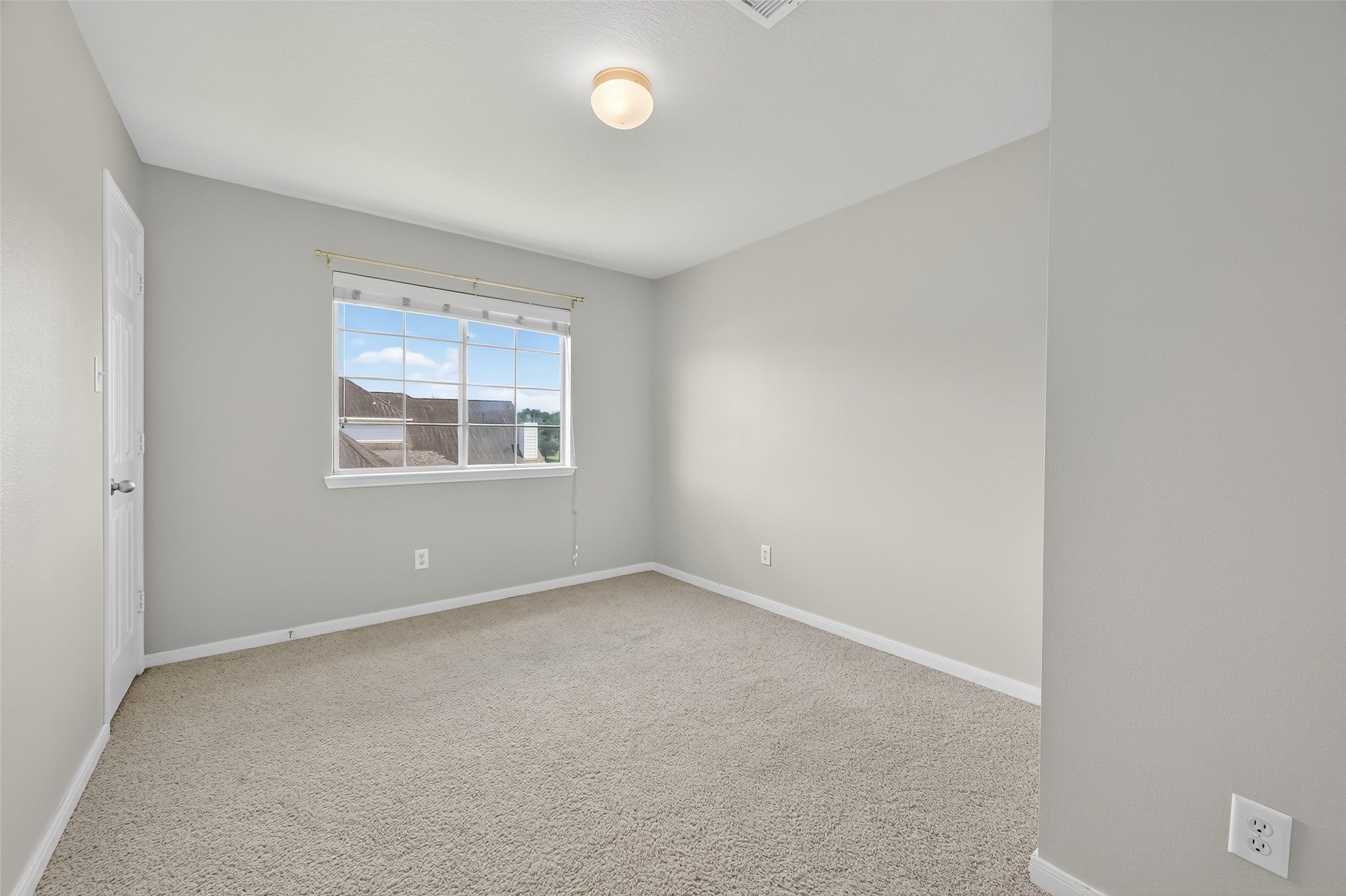 12902 Crystal Reef Court Pearland, TX 77584 - Photo 22 of 35 an empty room with windows
