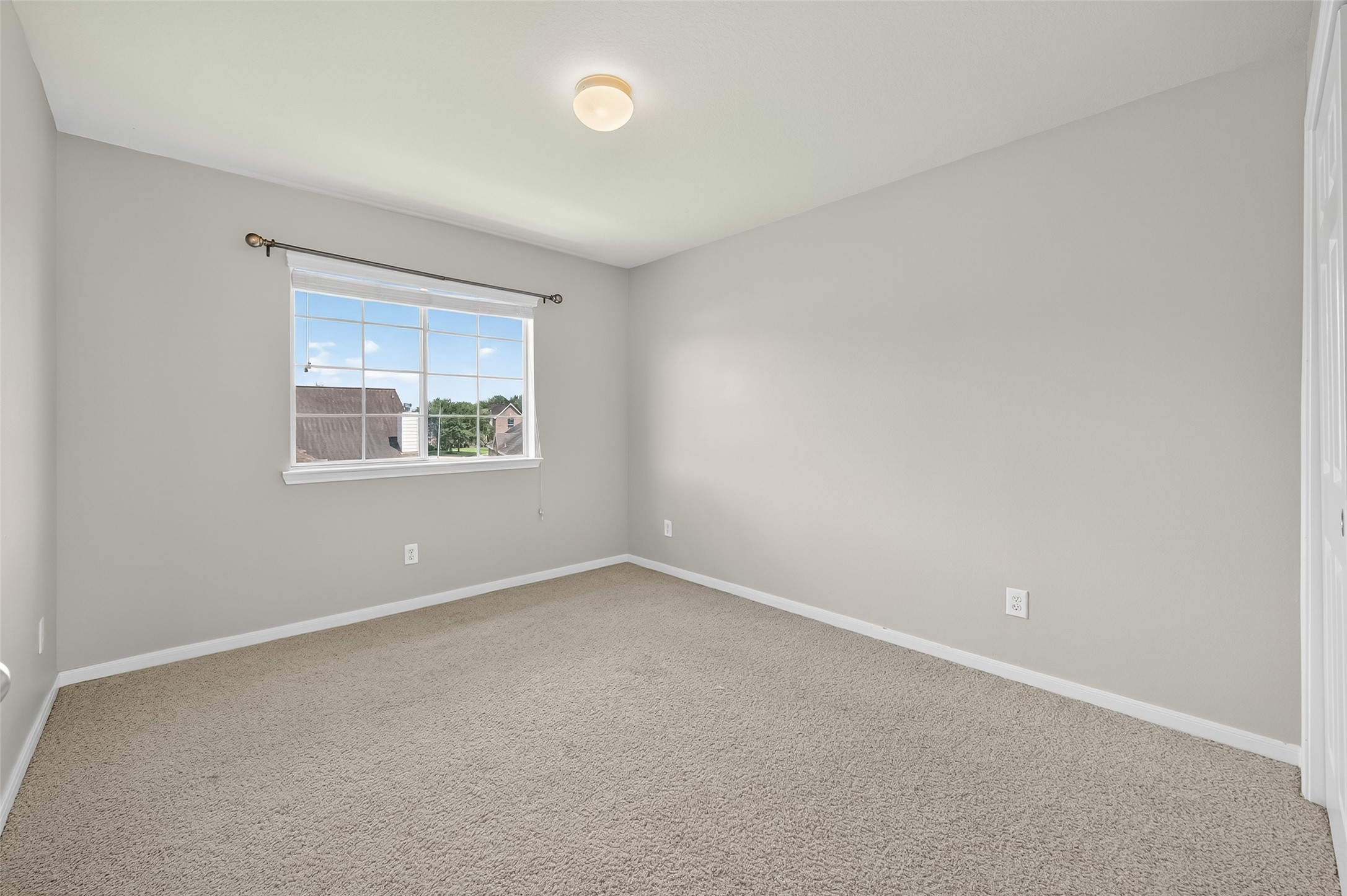 12902 Crystal Reef Court Pearland, TX 77584 - Photo 25 of 35 an empty room with a window