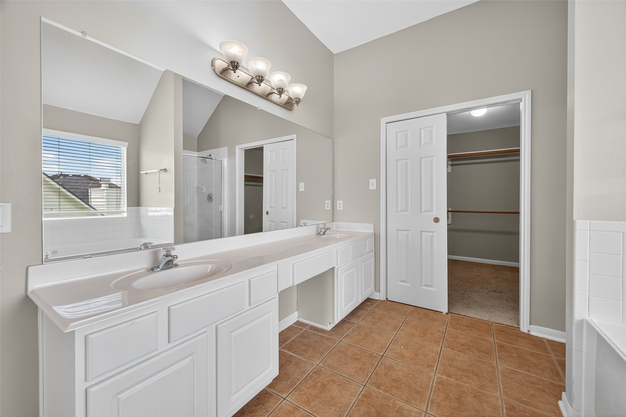 12902 Crystal Reef Court Pearland, TX 77584 - Photo 32 of 35 a bathroom with a sink vanity and a mirror